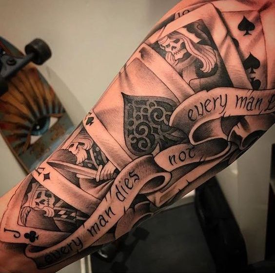 A tattoo of a pack of cards with gambling symbols.